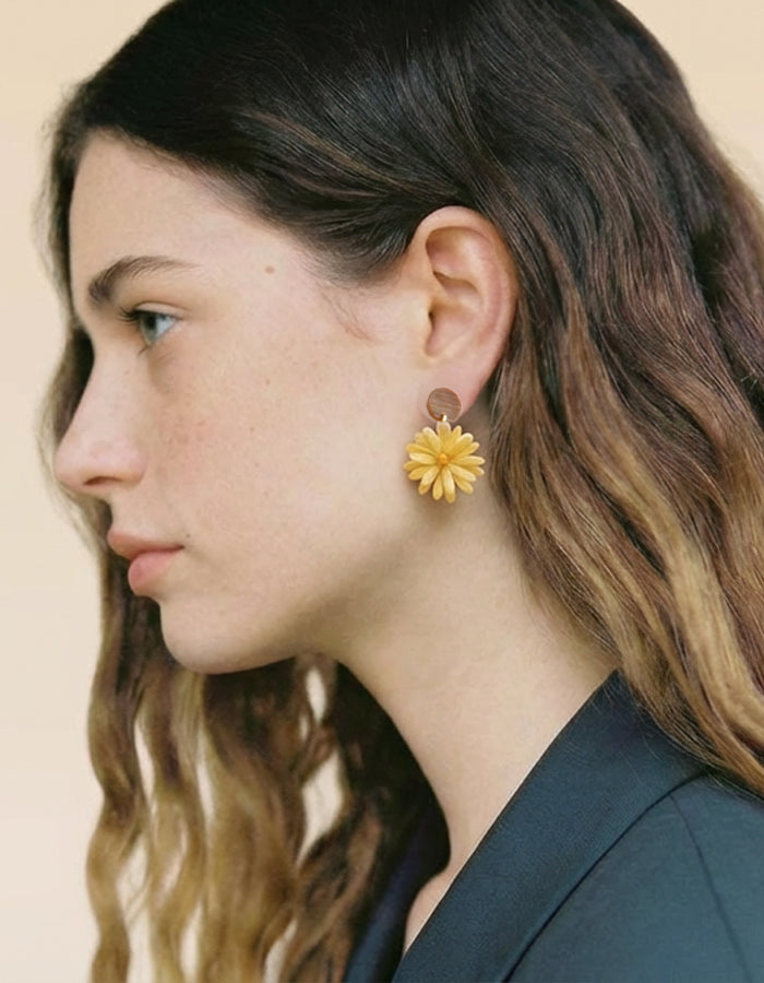 Model wearing handcrafted jewelry inspired by tradition and nature